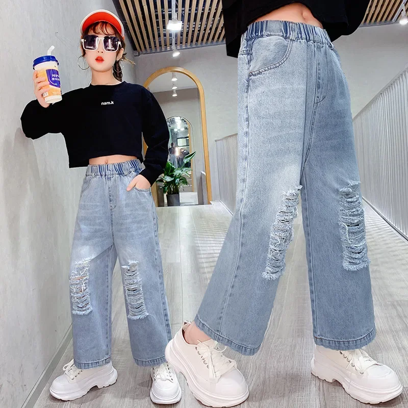 Модные рваные джинсы для девочек, весенне-осенние джинсовые брюки, Детские Корейские Подростковые Свободные брюки, одежда для девочек 5-14 лет Изображение 0
