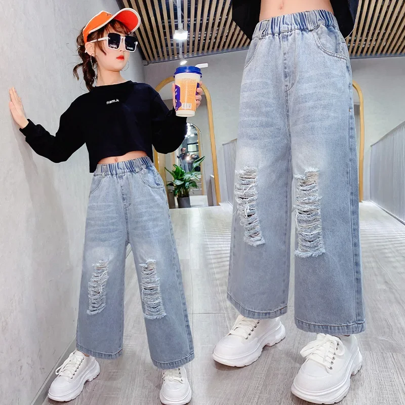 Модные рваные джинсы для девочек, весенне-осенние джинсовые брюки, Детские Корейские Подростковые Свободные брюки, одежда для девочек 5-14 лет Изображение 1